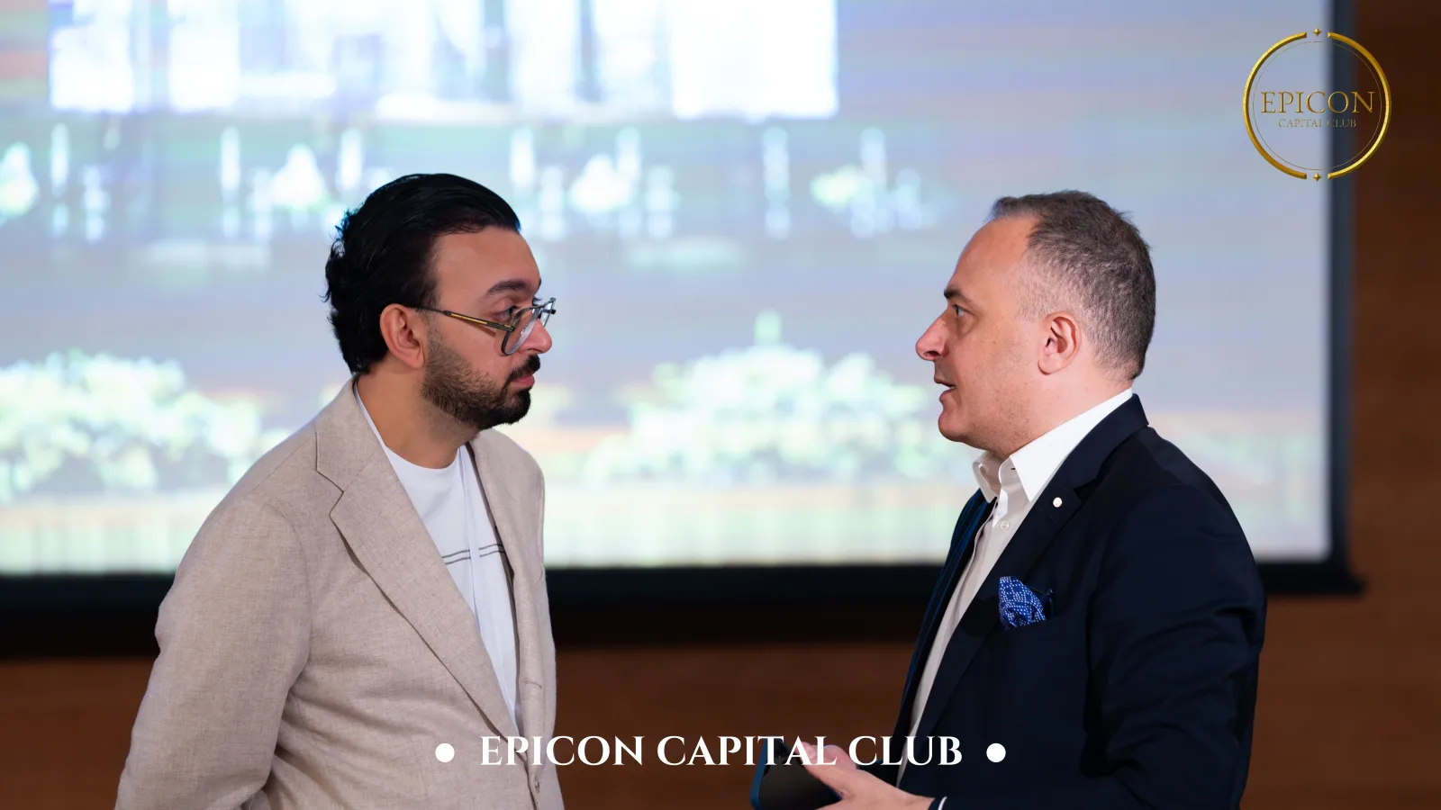 Two delegates in a private conversation at the Summit